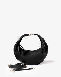 Black leather hobo bag with gold ring detail and shoulder straps, HYER GOODS Ring Bag styled for everyday use.