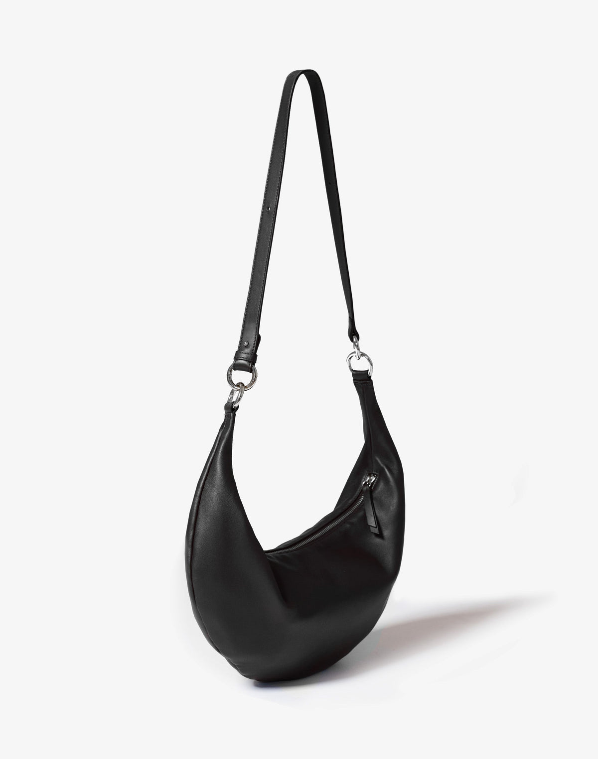 Black and silver HYER GOODS Ring Bag hobo crossbody bag with circular ring detail and adjustable strap.