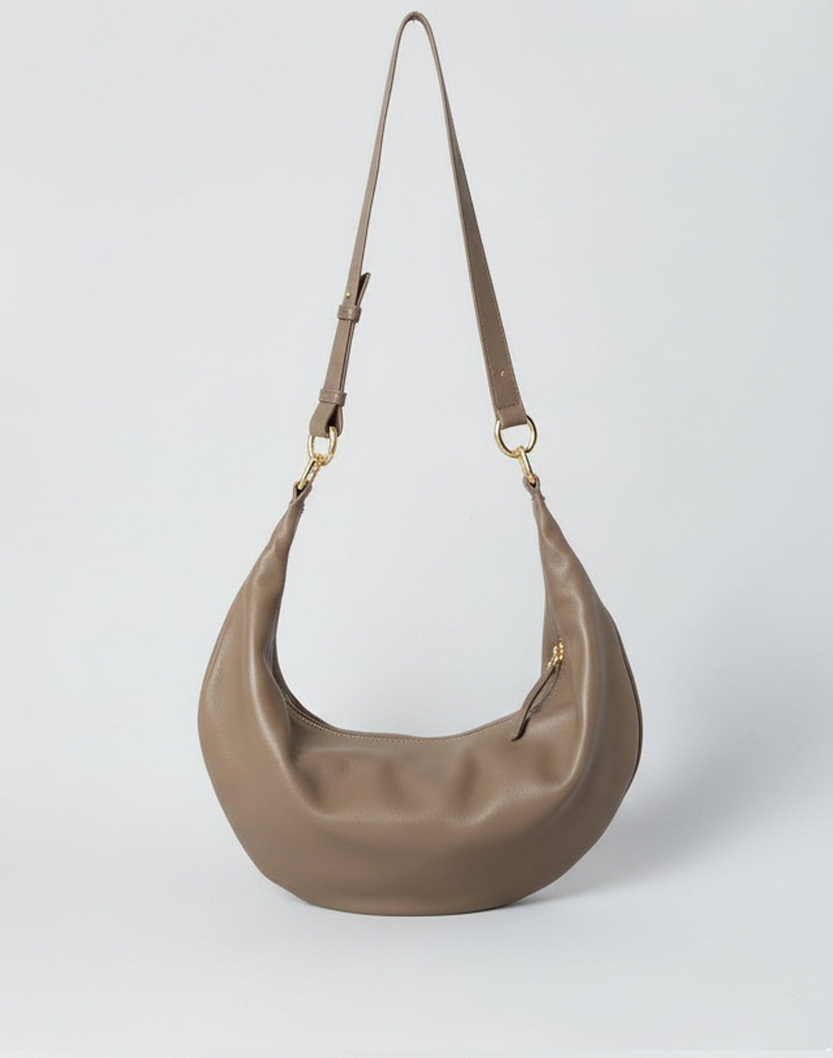 Hyer Goods Ring Bag hobo bag in taupe leather with a circular handle and minimalist design.