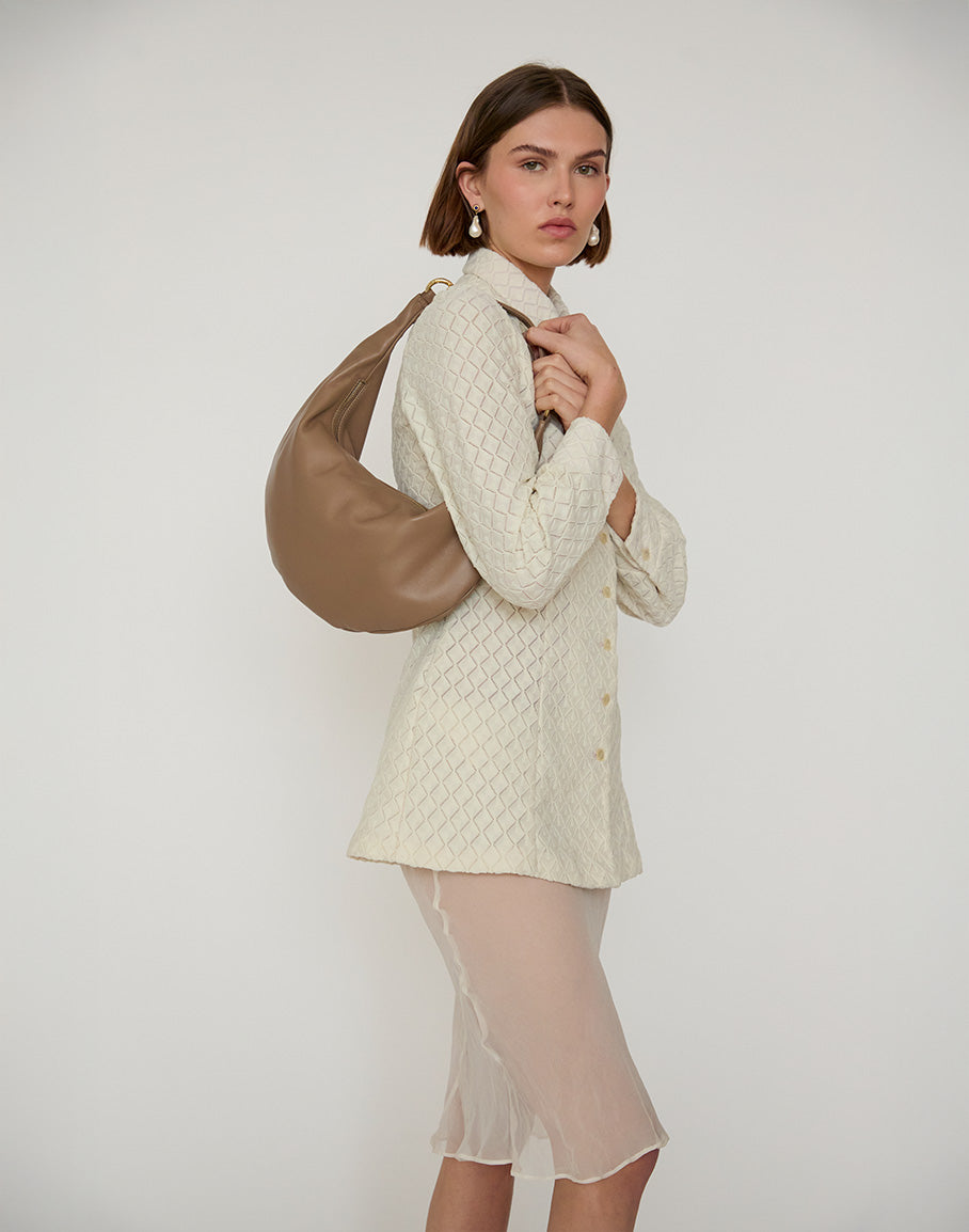 Taupe hobo bag called The Ring Bag by HYER GOODS featuring a stylish, rounded design and top handle for everyday wear.