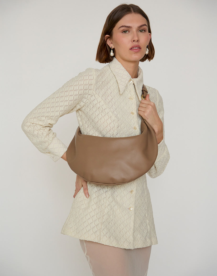 Taupe HYER GOODS Ring Bag hobo bag with circular handle and soft leather texture, stylishly displayed on a neutral background.