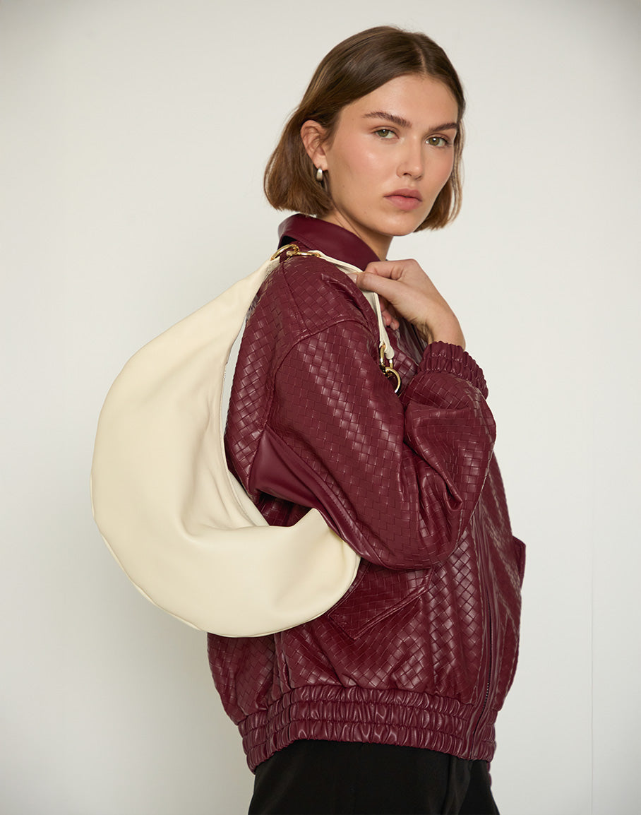 Off-white HYER GOODS Ring Bag hobo bag with circular handle and minimalist design, stylishly displayed.