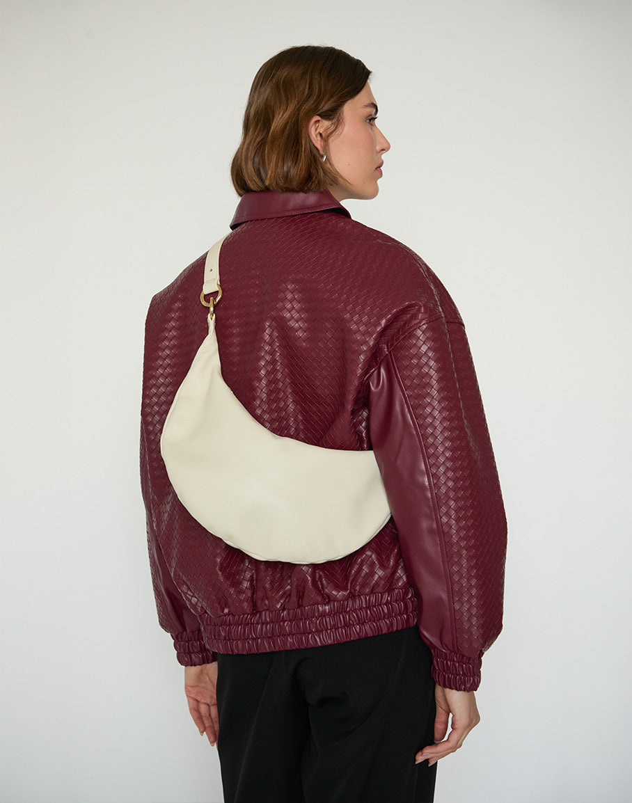 Off-white HYER GOODS Ring Bag hobo bag with circular handle and minimalist design, stylishly displayed on a neutral background.
