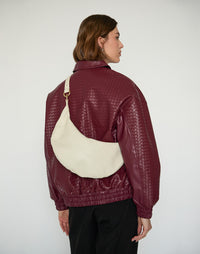 Off-white HYER GOODS Ring Bag hobo bag with circular handle and minimalist design, stylishly displayed on a neutral background.