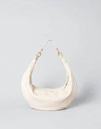 HYER GOODS Ring Bag hobo bag in off-white leather with circular ring detail, stylish and spacious for everyday use.