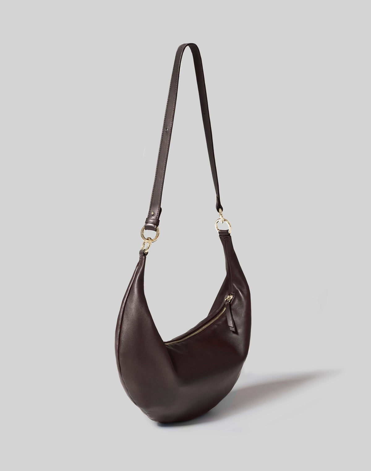 HYER GOODS Ring Bag hobo in chocolate leather with circular handle, crossbody strap, and minimalist design.