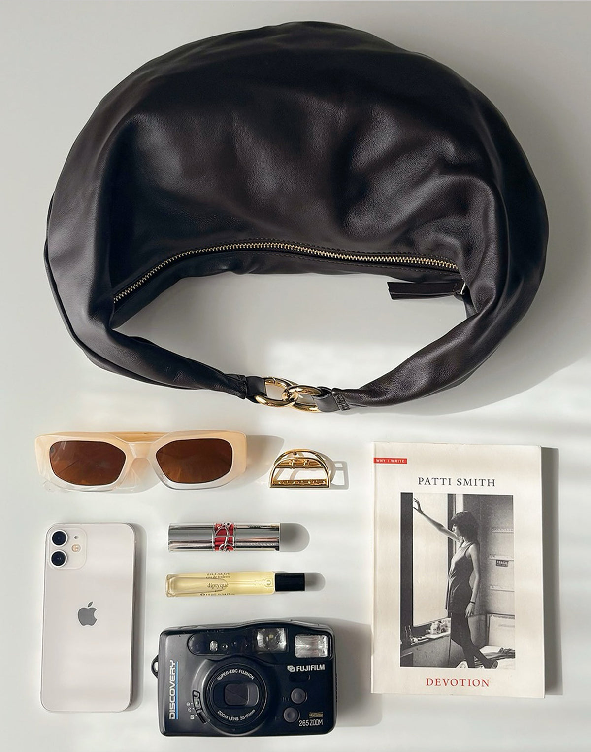 HYER GOODS dark chocolate Ring Bag, a stylish hobo bag with a circular ring detail, showcasing its spacious and modern design.