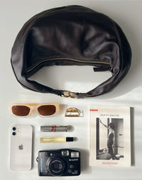 HYER GOODS dark chocolate Ring Bag, a stylish hobo bag with a circular ring detail, showcasing its spacious and modern design.