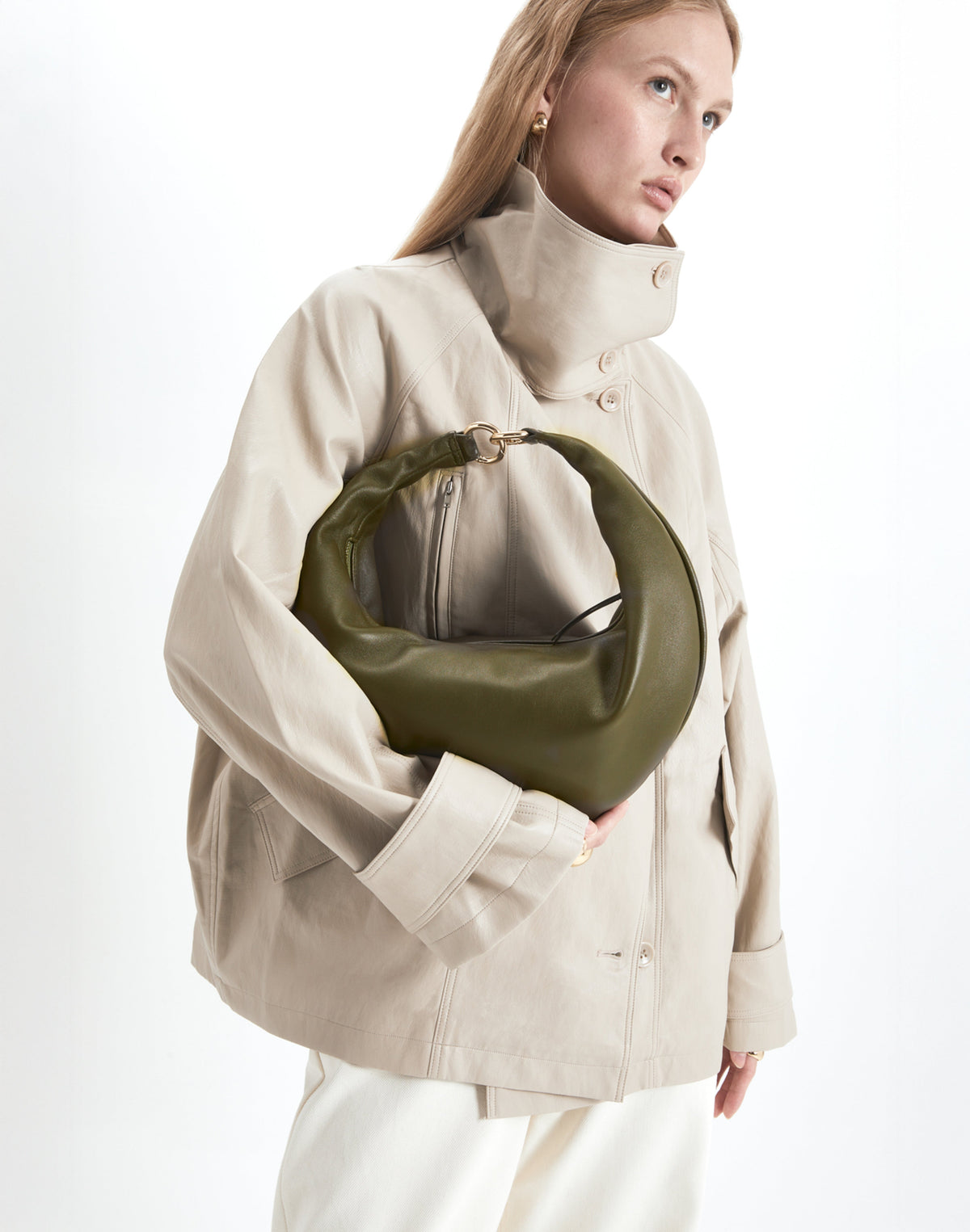 Olive-colored Hobo Bag by HYER GOODS featuring a circular ring design and soft leather texture.