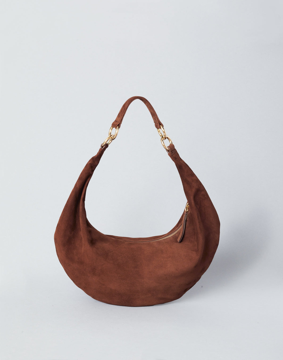 HYER GOODS Ring Bag hobo bag in praline suede with round ring handle and soft, textured surface.