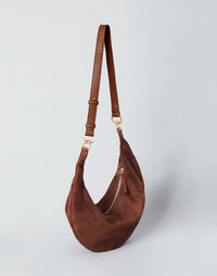 HYER GOODS Ring Bag hobo bag in praline suede featuring a rounded ring handle and soft, textured leather surface.