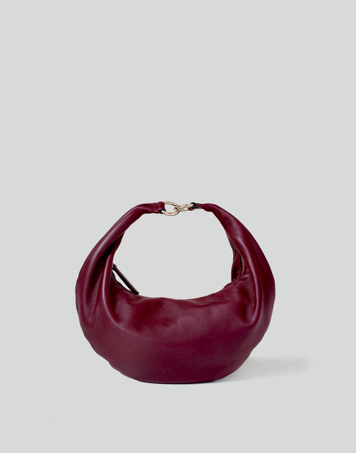 HYER GOODS Ring Bag hobo bag in Bordeaux color with a circular handle and minimalist design, front view with no straps.