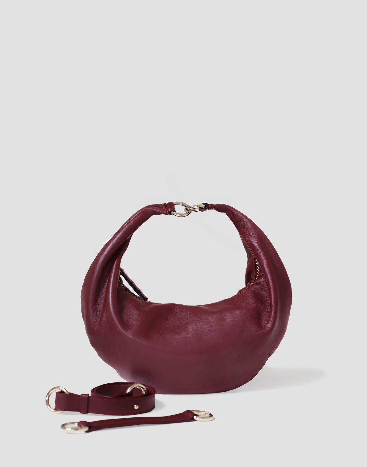 HYER GOODS Ring Bag hobo bag in Bordeaux with light grey straps, featuring a circular ring design and soft leather material.
