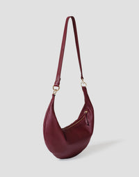 HYER GOODS The Ring Bag hobo crossbody bag in Bordeaux leather with a rounded handle and spacious interior.