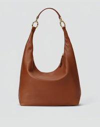 HYER GOODS Hobo Ring Bag in Cognac leather with adjustable strap and circular ring detail, casual and stylish for everyday use.