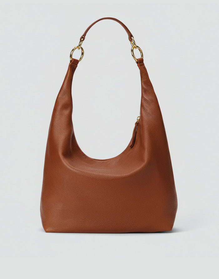 HYER GOODS Hobo Ring Bag in Cognac leather with adjustable strap and circular ring detail, casual and stylish for everyday use.