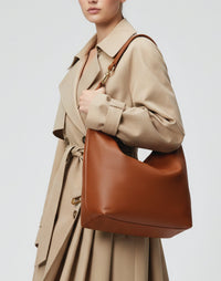 HYER GOODS cognac leather hobo ring bag with adjustable strap and spacious interior, stylish and functional for everyday use.