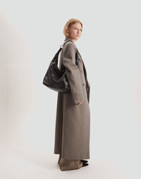 HYER GOODS Hobo Ring Bag in black with silver accents, stylish hobo bag featuring a unique ring handle and spacious interior.