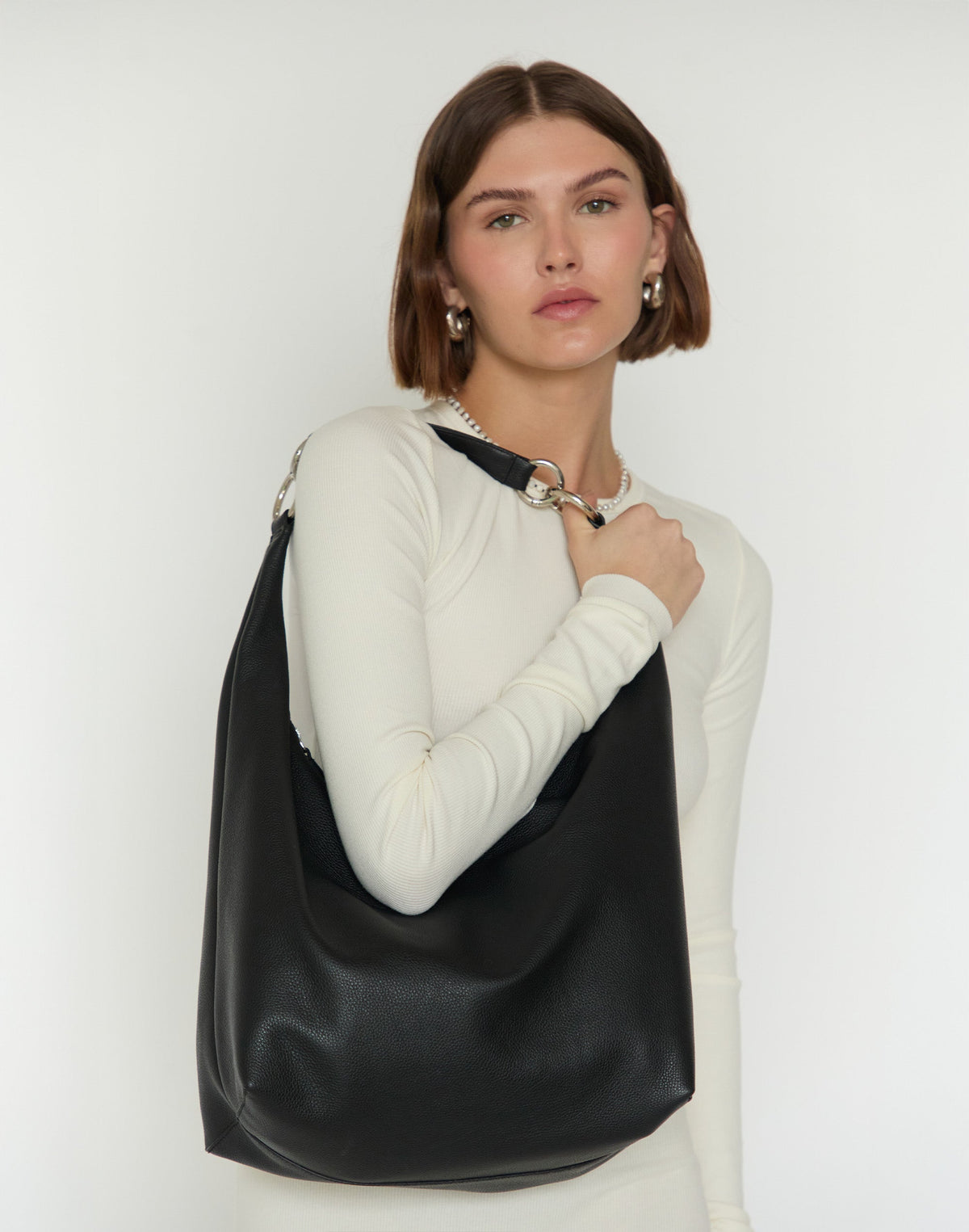 HYER GOODS Hobo Ring Bag in black and silver featuring a stylish hobo bag design with ring accents.