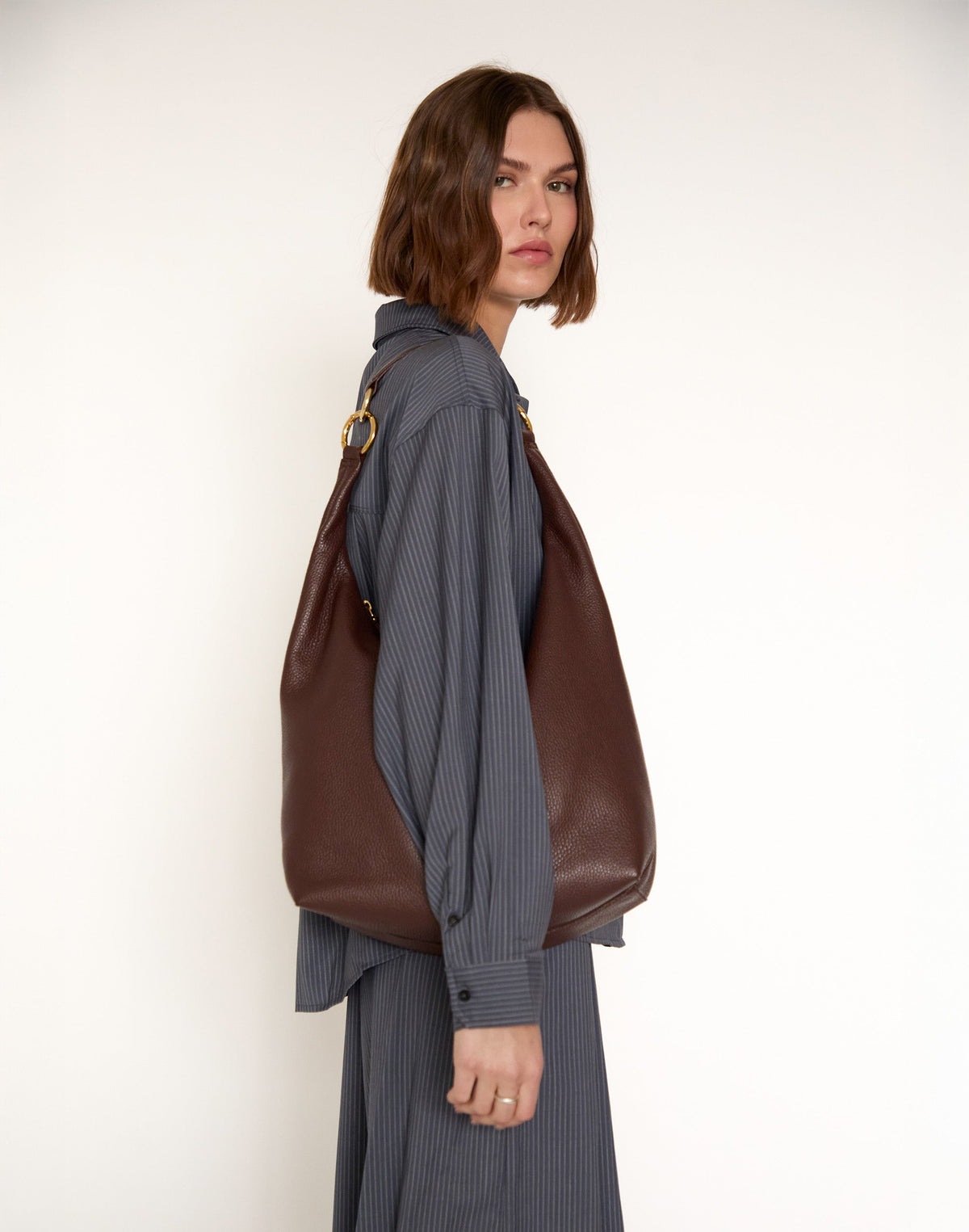 Brown HYER GOODS Hobo Ring Bag with rounded leather body and adjustable strap, stylish and functional for everyday use.