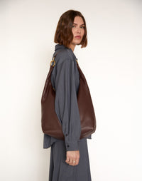 Brown HYER GOODS Hobo Ring Bag with rounded leather body and adjustable strap, stylish and functional for everyday use.