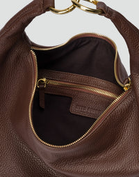 Brown HYER GOODS Hobo Ring Bag with rounded shape, adjustable strap, and stylish design, shown from the side.