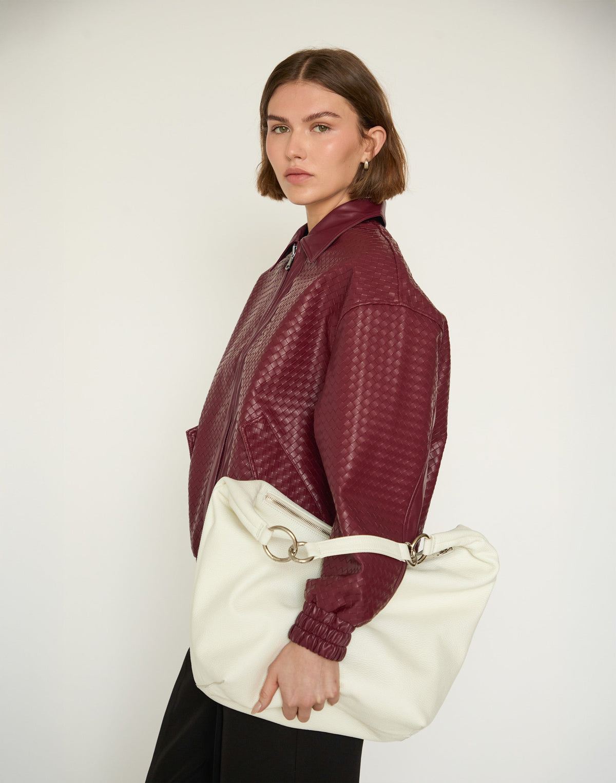 White HYER GOODS Hobo Ring Bag with rounded leather design and adjustable shoulder strap, stylish and functional for everyday use.