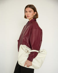 White HYER GOODS Hobo Ring Bag with rounded leather design and adjustable shoulder strap, stylish and functional for everyday use.