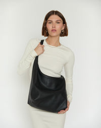 Black and gold HYER GOODS Hobo Ring Bag featuring a crossbody strap and stylish design.