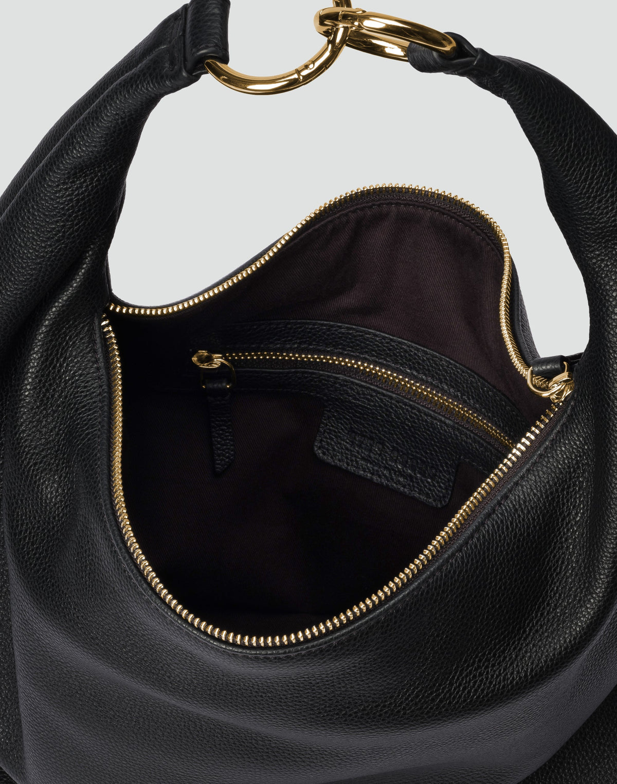 Black and gold Hobo Bag from HYER GOODS featuring a versatile, spacious design with a rounded shape and adjustable strap.