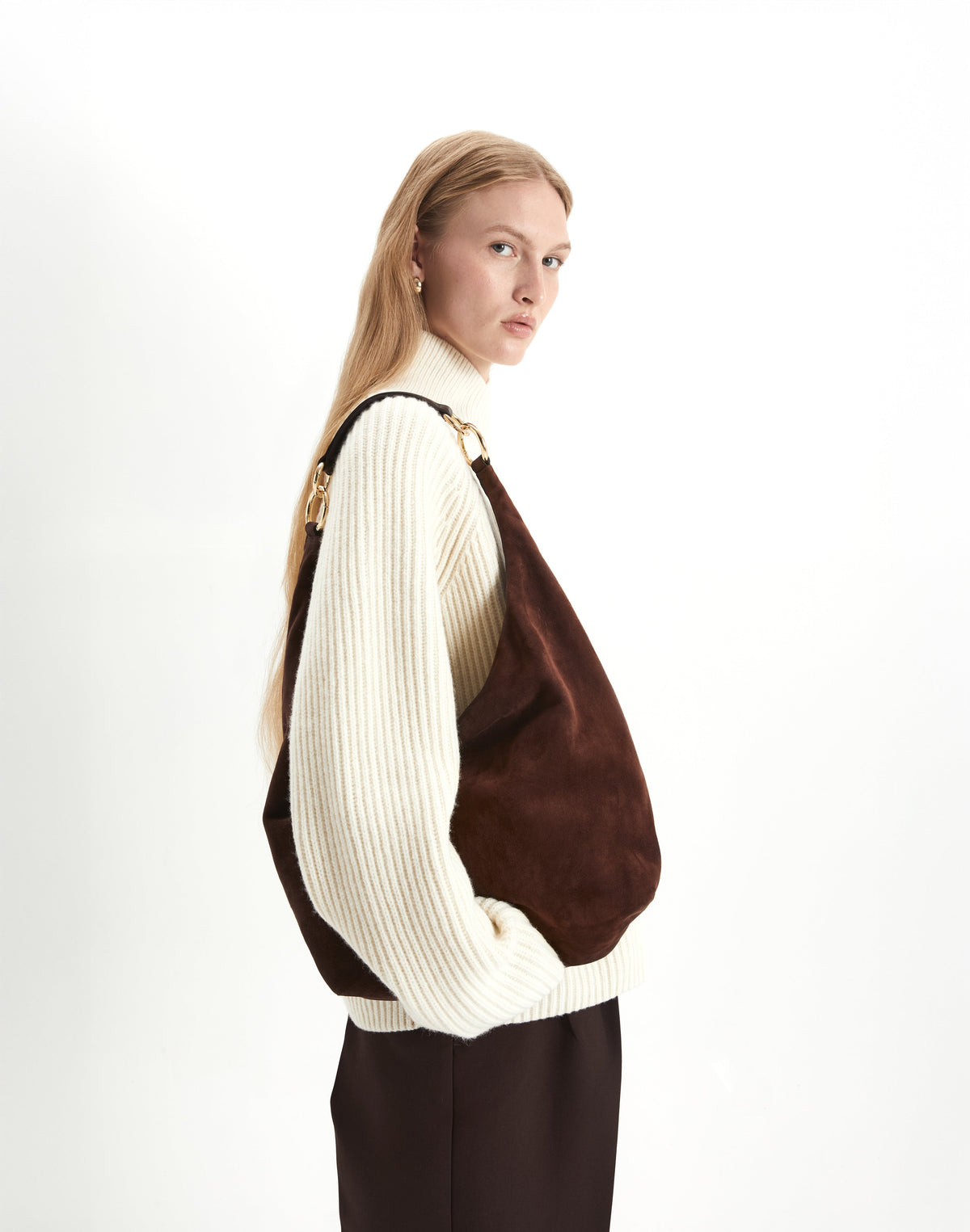 HYER GOODS hobo bag in chocolate suede with a rounded shape, featuring a comfortable shoulder strap and minimalistic design.
