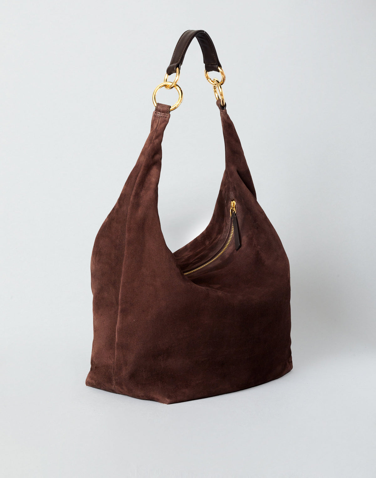 HYER GOODS hobo bag in chocolate suede with a rounded shape and top handle, showcasing its stylish and soft leather design.