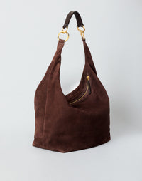 HYER GOODS hobo bag in chocolate suede with a rounded shape and top handle, showcasing its stylish and soft leather design.