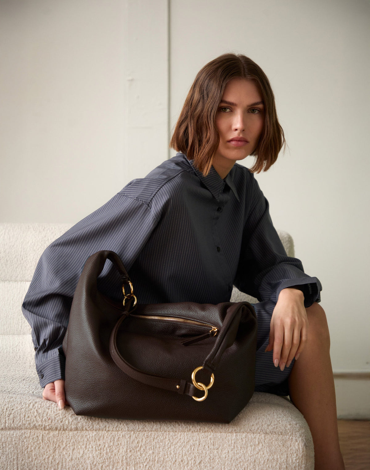 Dark chocolate leather Hobo Bag by HYER GOODS featuring a spacious hobo-style design and single shoulder strap.