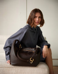 Dark chocolate leather Hobo Bag by HYER GOODS featuring a spacious hobo-style design and single shoulder strap.
