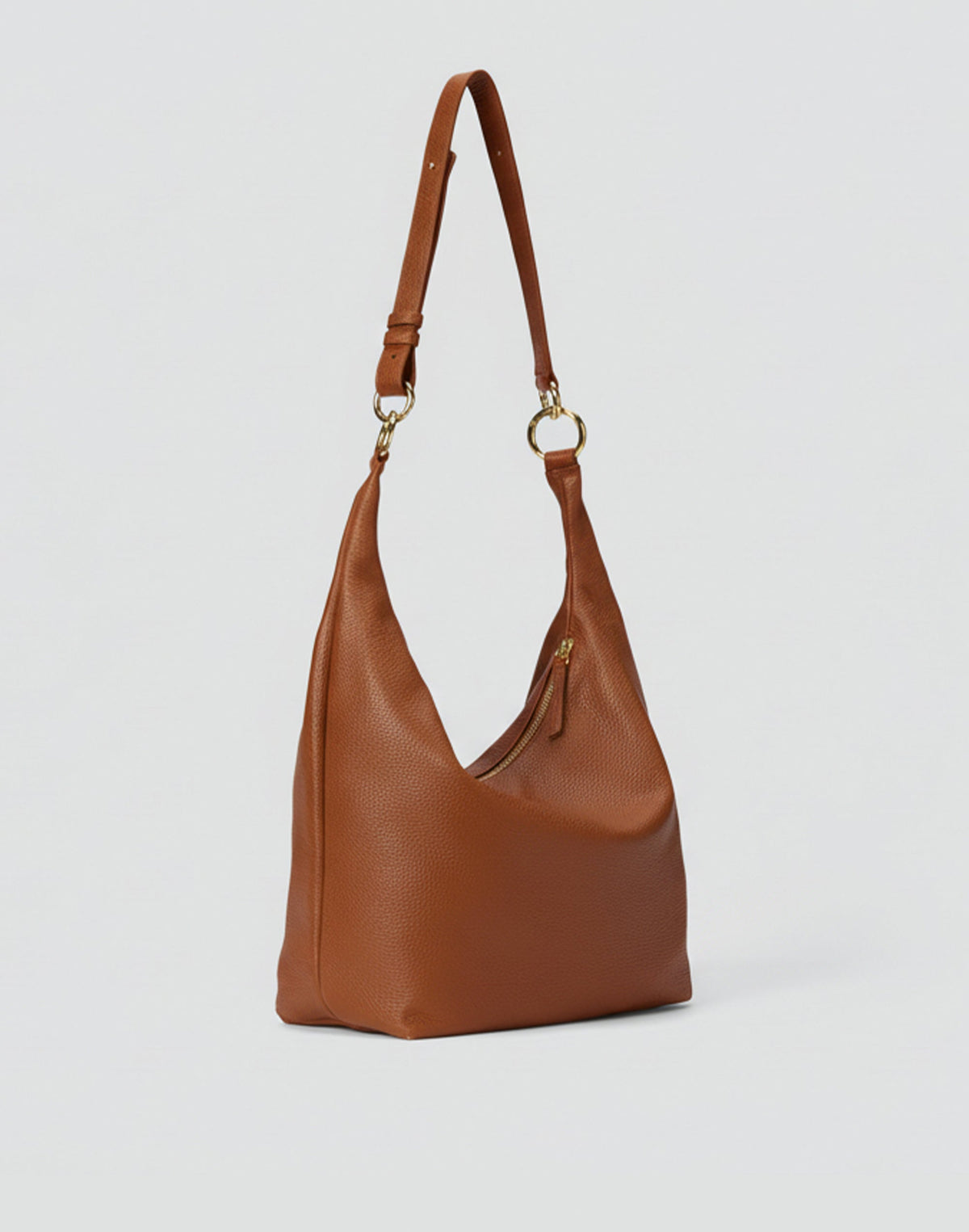 HYER GOODS Hobo Ring Bag in cognac leather, stylish hobo bag with unique ring detail and spacious interior.