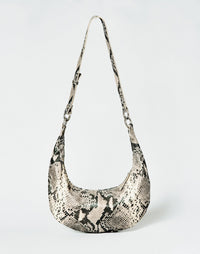 HYER GOODS Piccola Ring Bag hobo bag in python leather with circular handle and compact design.