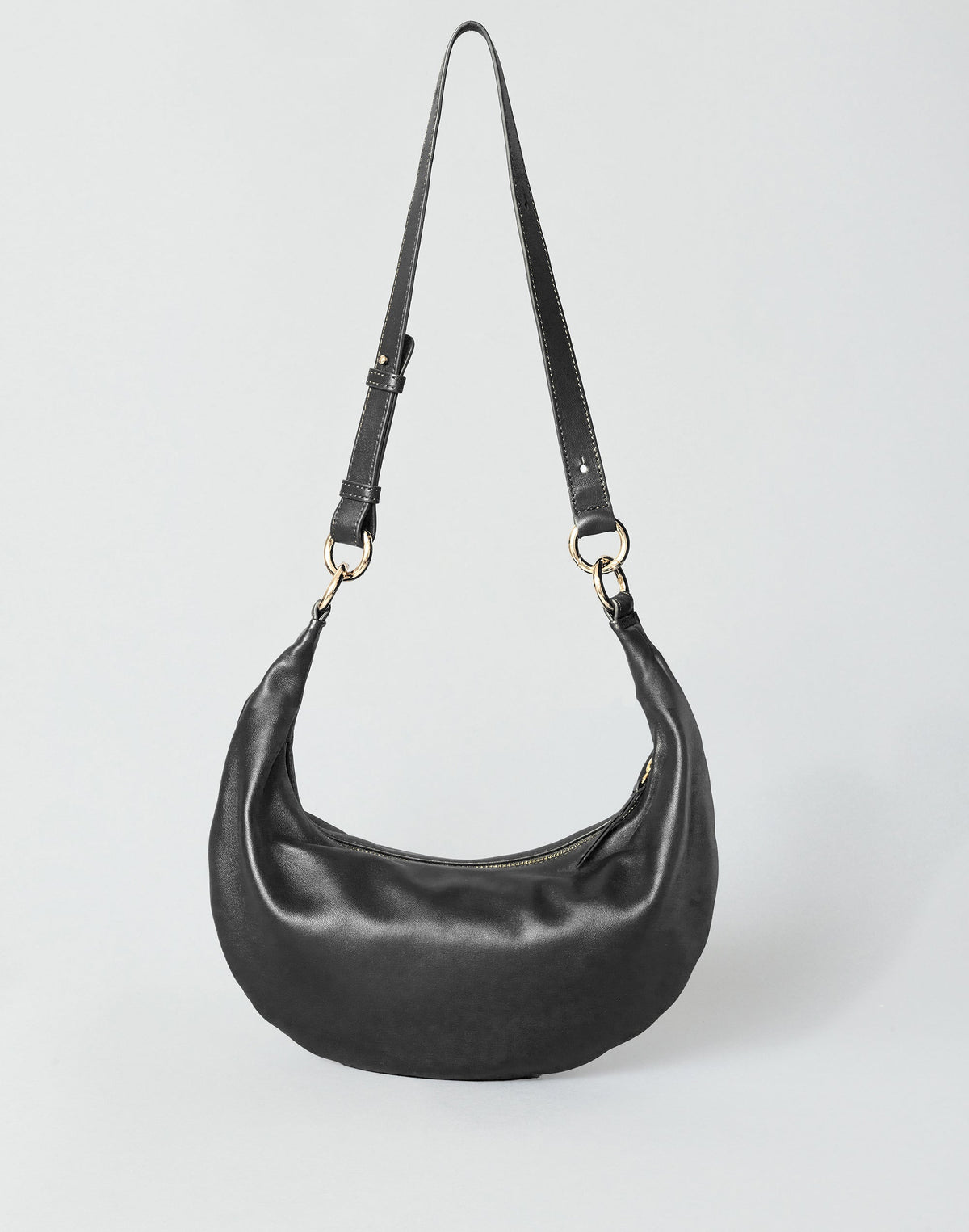 HYER GOODS Piccola Ring Bag hobo bag in black with gold hardware, featuring a crossbody strap and compact design.