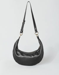 HYER GOODS Piccola Ring Bag hobo bag in black with gold hardware, featuring a crossbody strap and compact design.