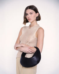 HYER GOODS Piccola Ring Bag hobo bag in black leather with gold hardware, stylish and compact for everyday use.