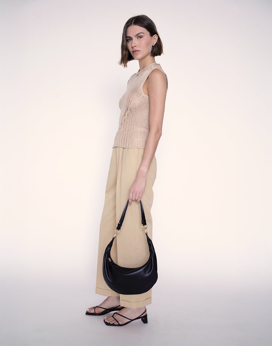HYER GOODS Piccola Ring Bag hobo bag in black with gold accents, showcasing a compact and stylish design.