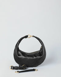 Black and gold Piccola Ring Bag by HYER GOODS, a stylish hobo bag with a sleek design and ring detail.