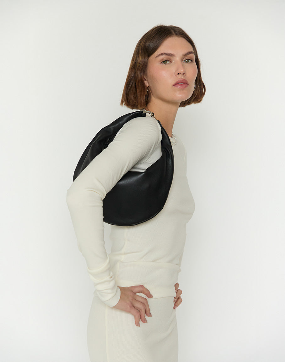 HYER GOODS Piccola Ring Bag in black with silver accents, stylish hobo bag featuring a sleek design and circular handle.