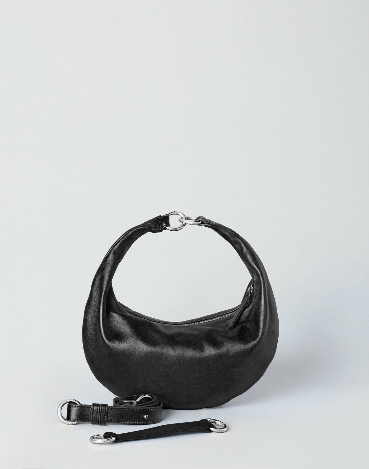 HYER GOODS Piccola Ring Bag hobo bag in black with silver accents, featuring a compact design and rounded handle strap.