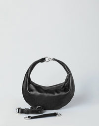 HYER GOODS Piccola Ring Bag hobo bag in black with silver accents, featuring a compact design and rounded handle strap.