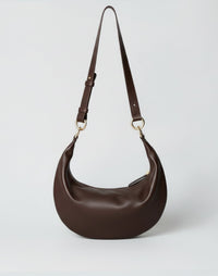 HYER GOODS Piccola Ring Bag hobo bag in dark chocolate and nappa leather with circular handle and minimalist design