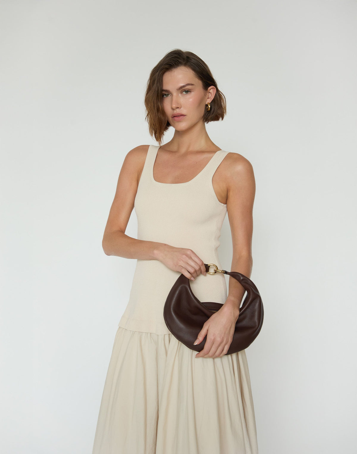 Hyer Goods Piccola Ring Hobo Bag in chocolate leather with circular handle and minimalist design, casual and stylish for everyday use.