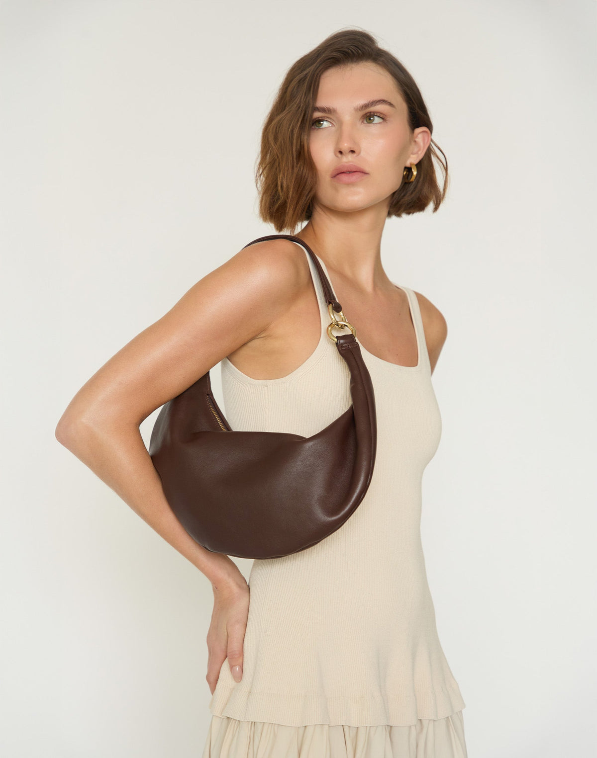 HYER GOODS Piccola Ring Bag, chocolate brown hobo bag with a rounded shape and ring handle, crafted from smooth leather.