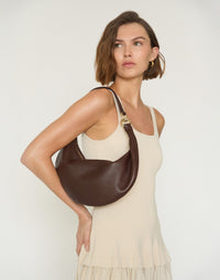 HYER GOODS Piccola Ring Bag, chocolate brown hobo bag with a rounded shape and ring handle, crafted from smooth leather.