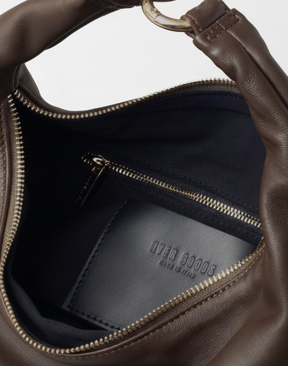 HYER GOODS Piccola Ring Bag hobo bag in dark chocolate napa leather, showing its interior with ring handle detail.